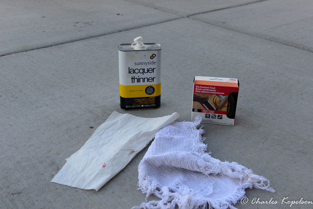 Clean off the surface with solvent that will remove all dirt, wax and oils.