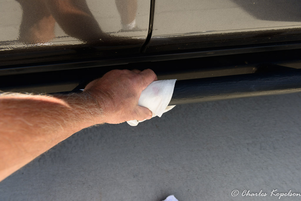 Clean off the surface with solvent that will remove all dirt, wax and oils.
