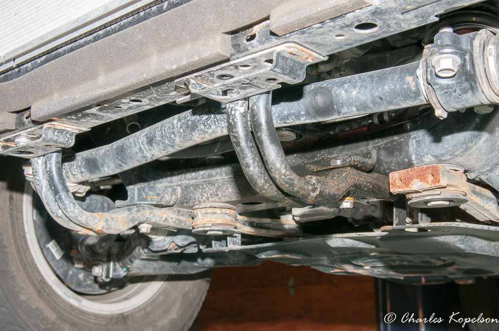 Remove the Front skid plate tubular braces.