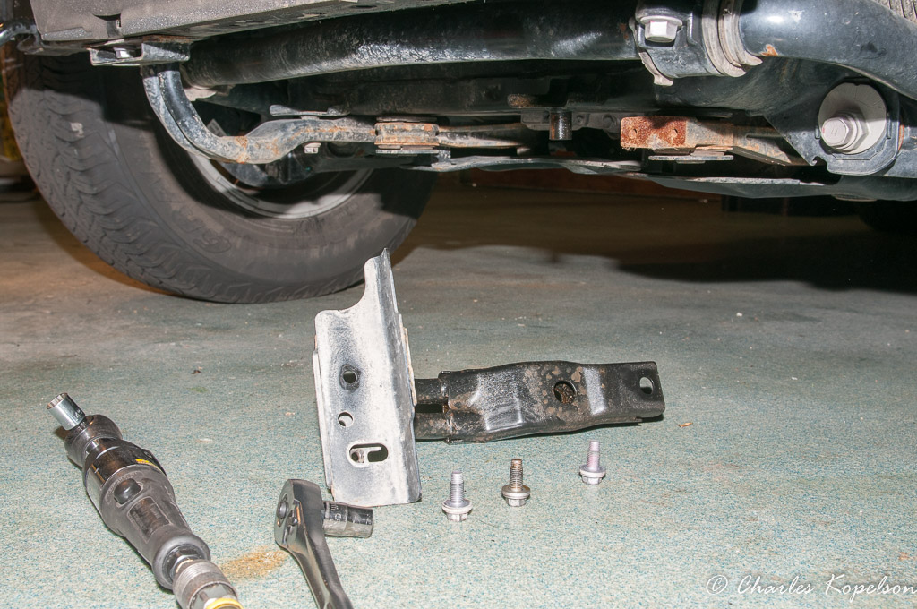 Front skid plate tubular braces are fastened on with 3 bolts.