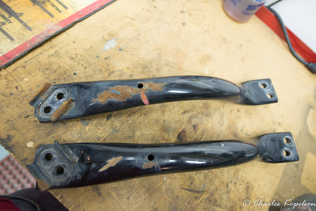 The factory  transmission skidplate tubular suppost brackets that go between the t-case cross member and the frame are removed.