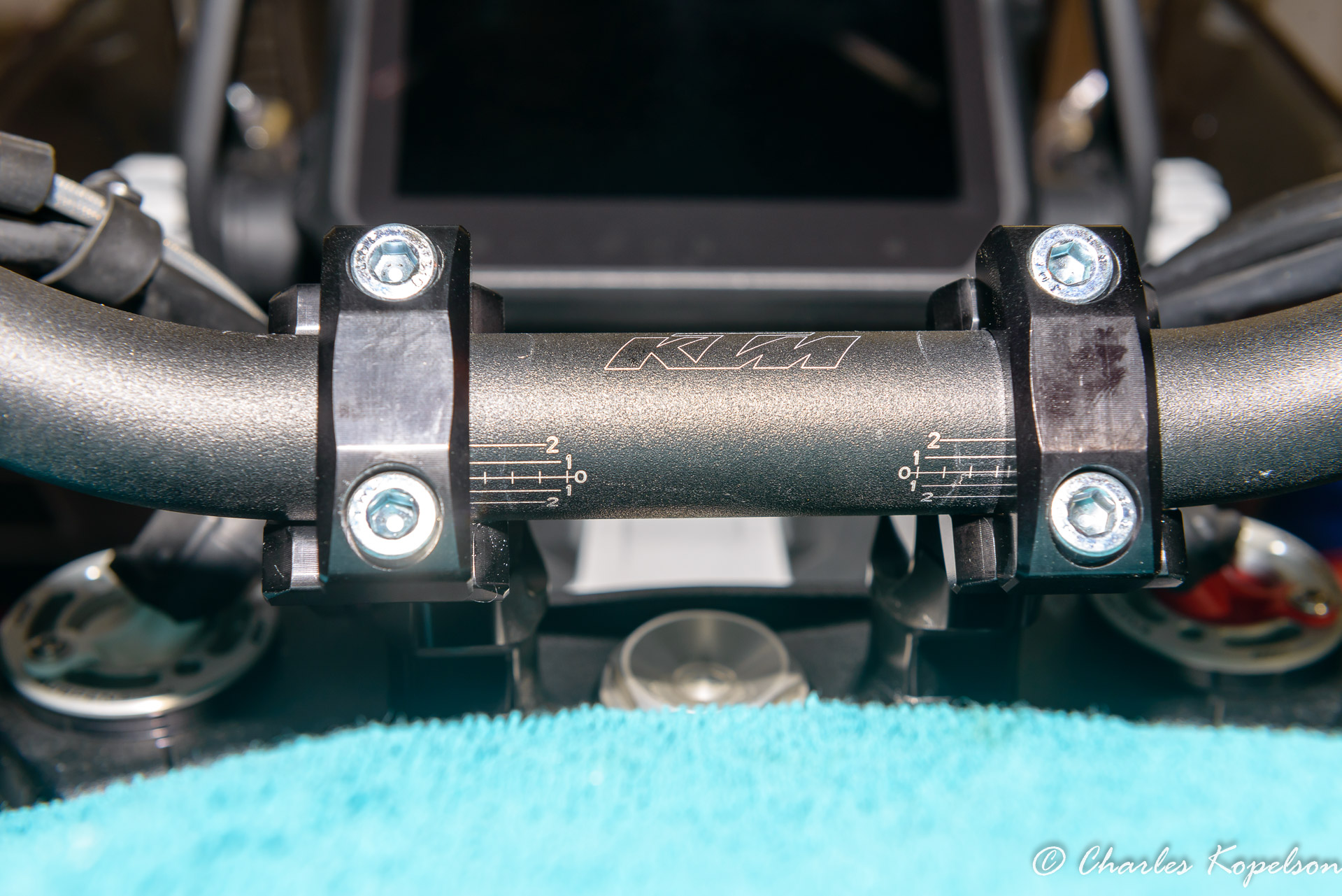 Rotate the risers to your desired position making sure to keep them even. Rotate the handlebar so the hand grips are level.