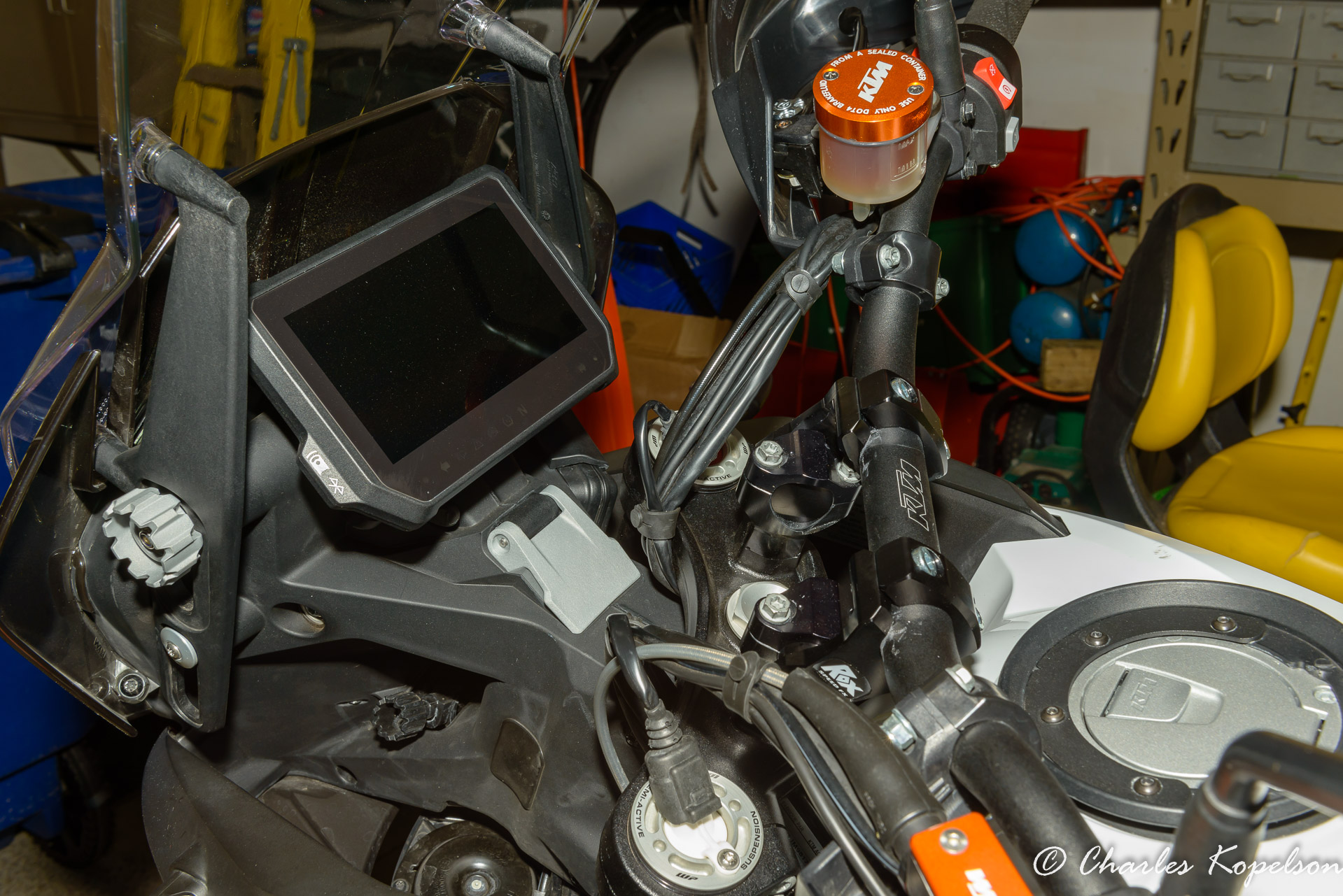 Too insure there are no binding cables or wires turn the front  end all the way to the right and all the way to the left. This is the left. There's a little pull on the wire bundle against the top tripple tree clamp.  Not enough to cause a problem since it will be seldom turned all the way to the stops.
