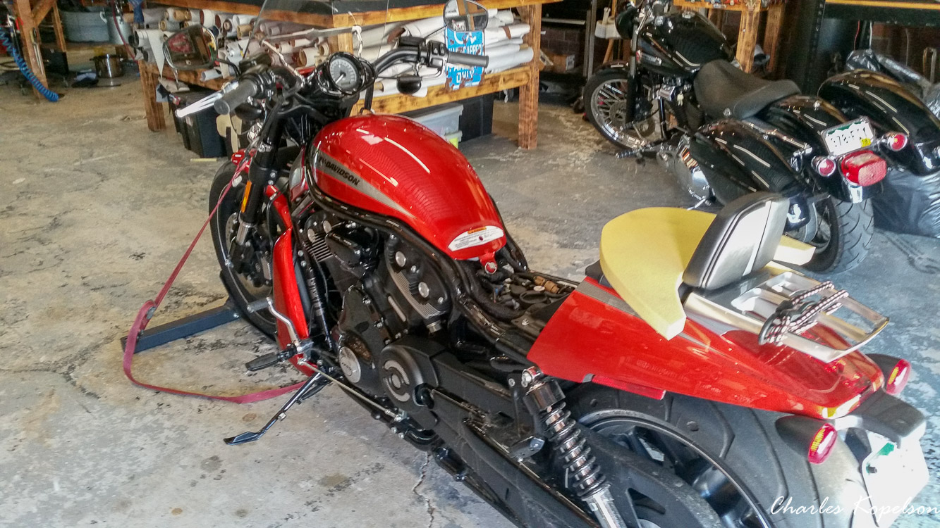 I waited about 5 weeks to get an appointment for a custom seat fitting at Bitchin Stitchin in Lakewood Colorado. They tie the bike upright. You sit on the bike and they look at your posture. The seat is removed  from my 2014 Harley Davidson Night Rod Special VRSCDX.