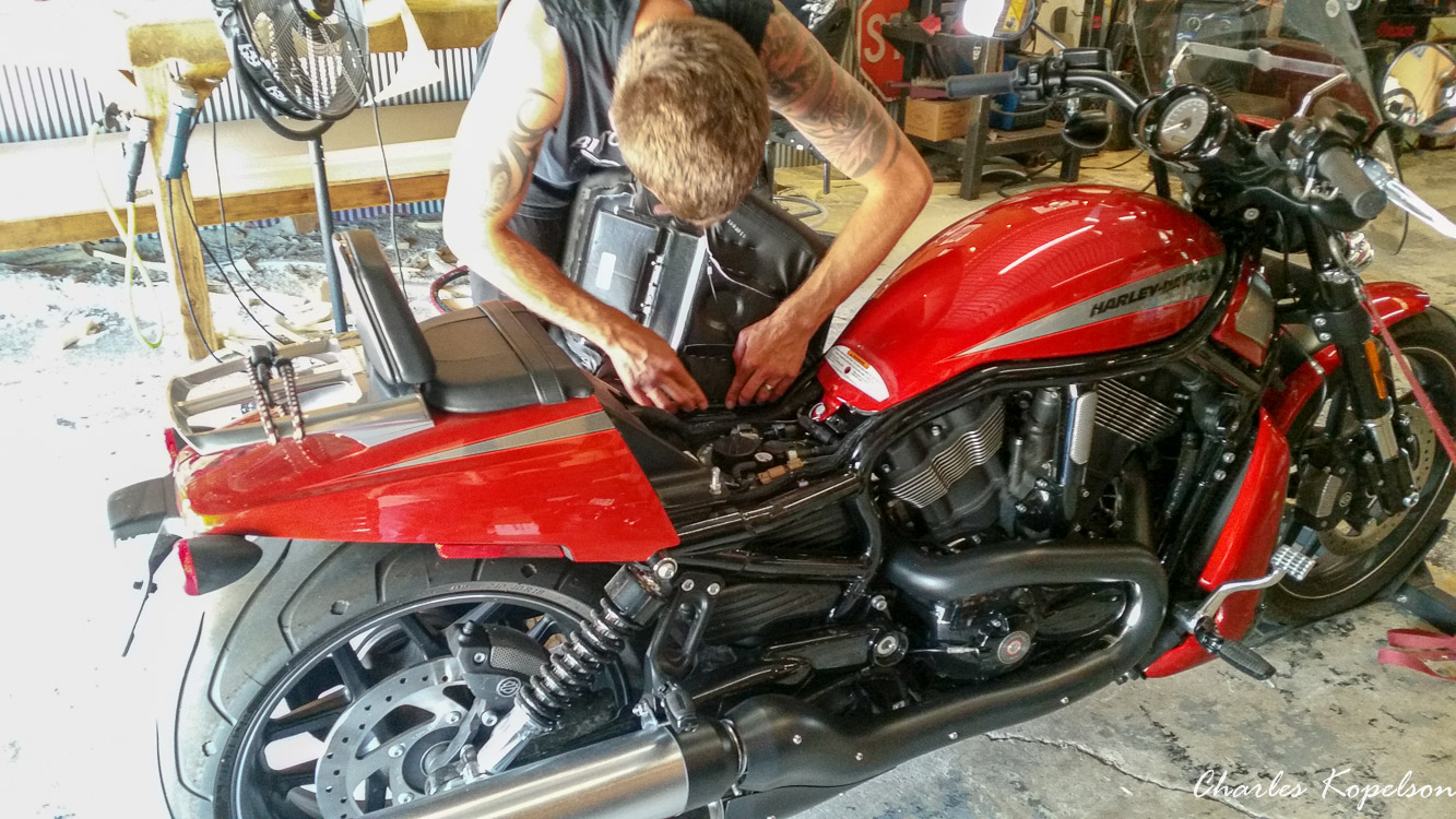I waited about 5 weeks to get an appointment for a custom seat fitting at Bitchin Stitchin in Lakewood Colorado. They tie the bike upright. You sit on the bike and they look at your posture. The seat is removed  from my 2014 Harley Davidson Night Rod Special VRSCDX.