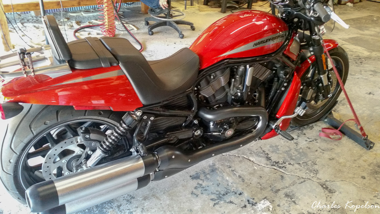 I waited about 5 weeks to get an appointment for a custom seat fitting at Bitchin Stitchin in Lakewood Colorado. They tie the bike upright. You sit on the bike and they look at your posture. The seat is removed  from my 2014 Harley Davidson Night Rod Special VRSCDX.