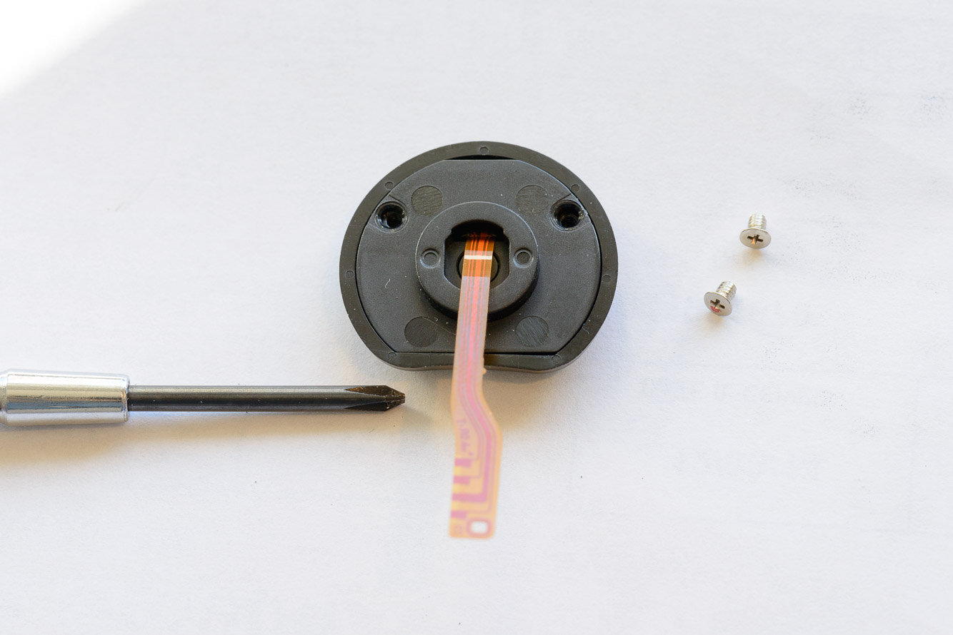 Remove the 2 screws on the new part.