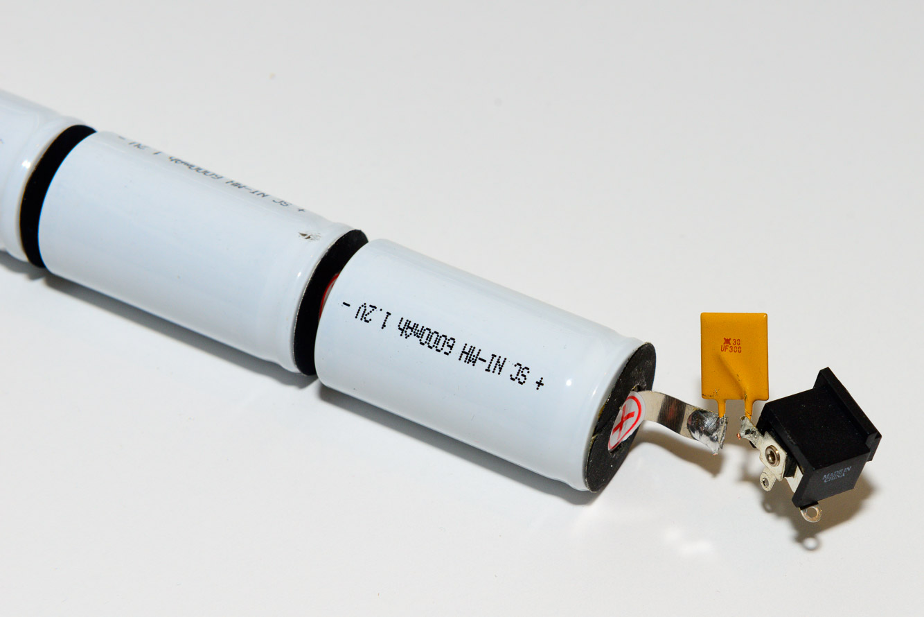 Carefully solder the thermistor to the positive battery tab.