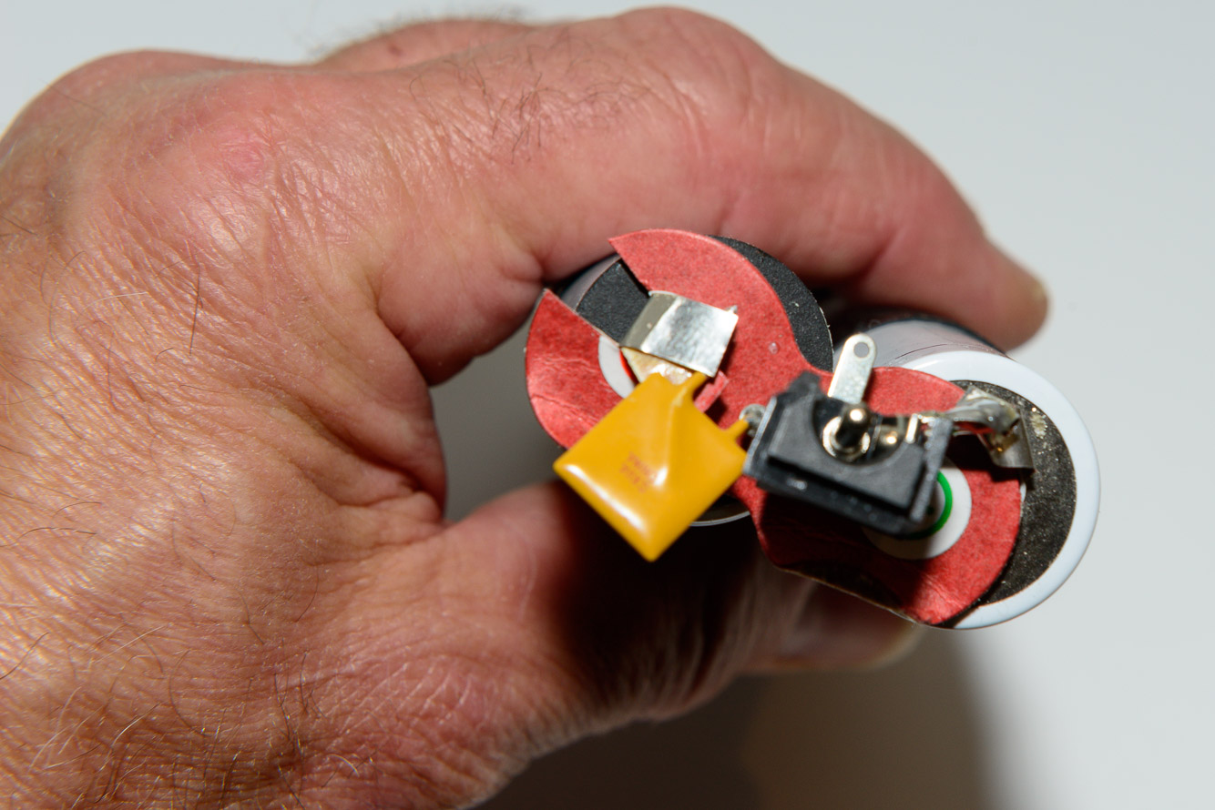 Put the insulator back between the socket and the batteries. At this point solder the positive and negative tabs together at the back of the 2 rows of batteries.  You will now have 7.5v at the socket.   If your socket was broken like mine make sure that the center post in the socket isn't touching the ground or you will get a direct short.